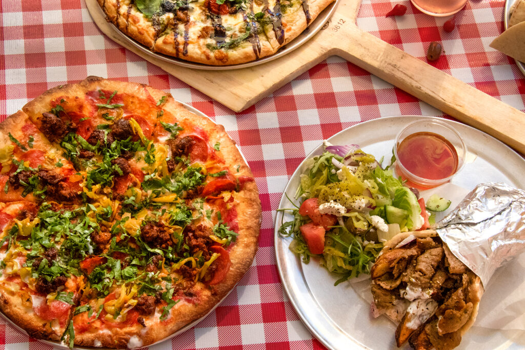 Phoenix and Kratos pizzas and gyros at Zimi on Mission. (Heather Irwin/Sonoma Magazine)