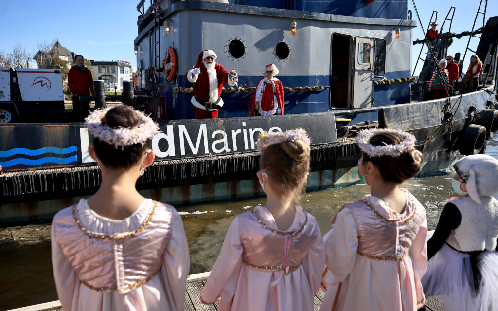 Santa and Mrs. Claus arrive by tugboat on the Petaluma River, Saturday, Nov. 27, 2021 in Petaluma. (Kent Porter / The Press Democrat) 2021