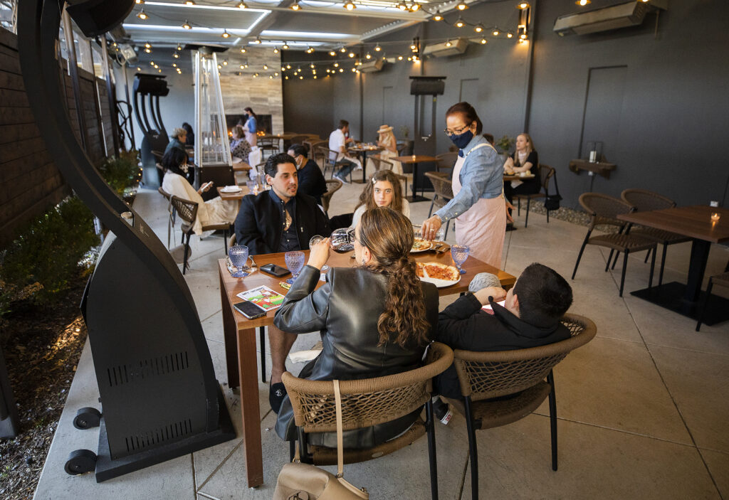 The back patio with covered seating at Wit & Wisdom in Sonoma. (John Burgess/The Press Democrat)