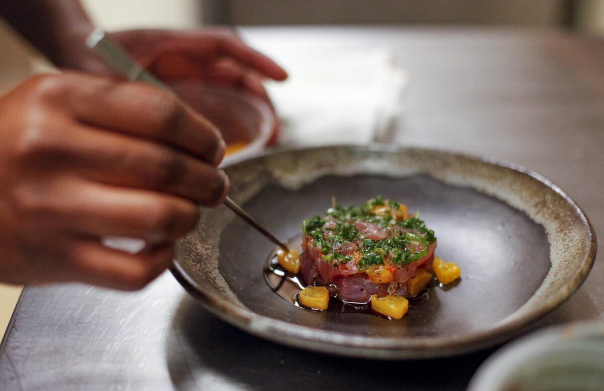 Chef Stéphane Saint Louis puts finishing touches on a dinner dish at Table Culture Provisions in Petaluma. (Crissy Pascual/Petaluma Argus-Courier) 