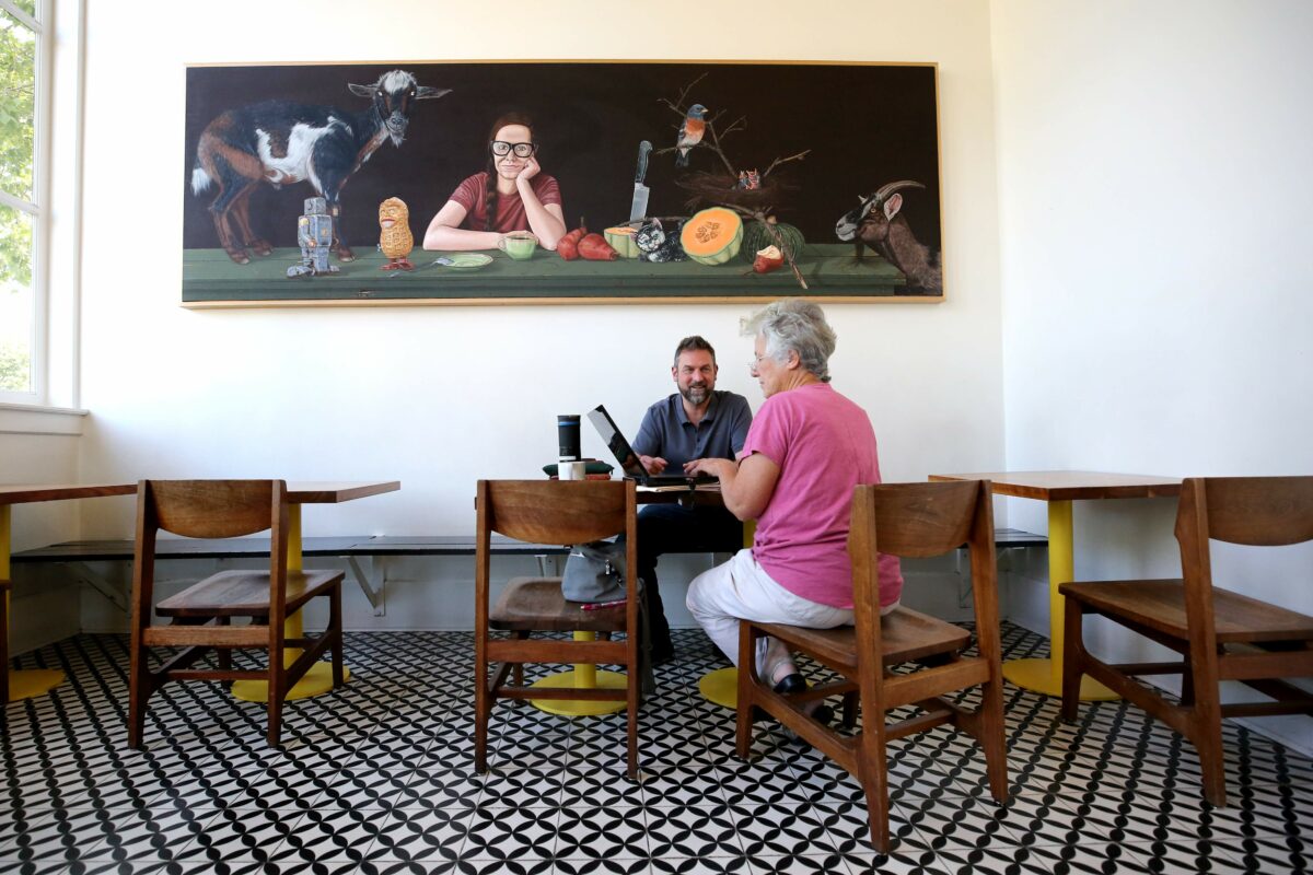 Steve Teaderman meets with bookkeeper Mary Anne Turbeville at Flying Goat Coffee in the Railroad Square area of Santa Rosa on Thursday, August 8, 2019. (BETH SCHLANKER/ The Press Democrat)