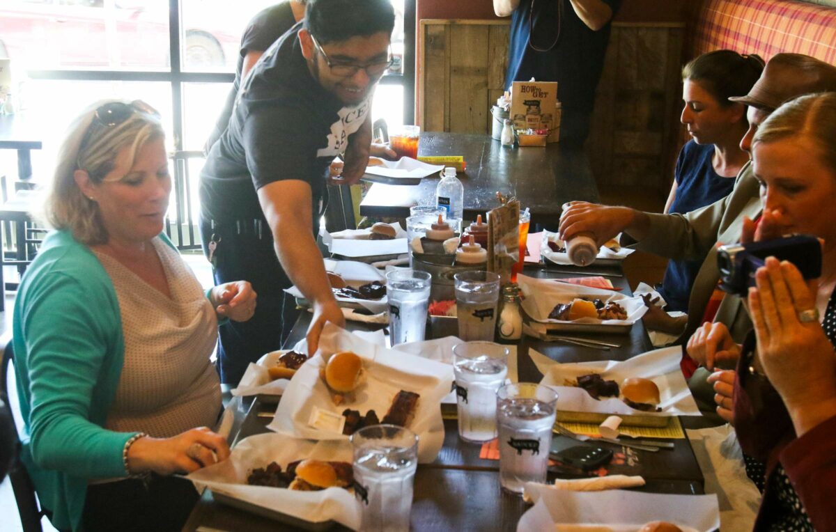 Tony Leon serves up BBQ at Sauced in Petaluma on Wednesday, August 5, 2015. (SCOTT MANCHESTER/ARGUS-COURIER STAFF)