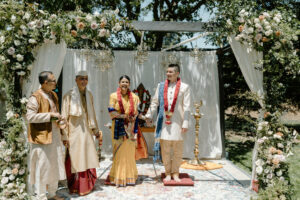 Gauri and Jeremy's celebrations began with a traditional Hindu ceremony officiated by Gauri's father. Later, the couple changed into Western wedding clothes for a second ceremony led by Jeremy's brother. (Photo by Aly Tovar)