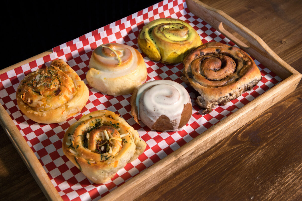 Assorted vegan rolls from Magdelena's Savories & Sweets are top row left to right: 1) a Vegor vegan with "Just Egg", Garlic, Cheese, Sweet Earth vegan bacon roll, 2) a Lemon roll with lemon frosting, 3) a Golden Mylk cinnamon roll with vegan chai cream cheese frosting, and bottom row left to right, 4) a Soyrizo, Pickled jalapeño, cheese & cilantro roll, 5) a Classic Cinnamon roll with vegan cream cheese frosting, 6) a Chocolate roll with Espresso frosting. (Photo by Darryl Bush / For The Press Democrat)