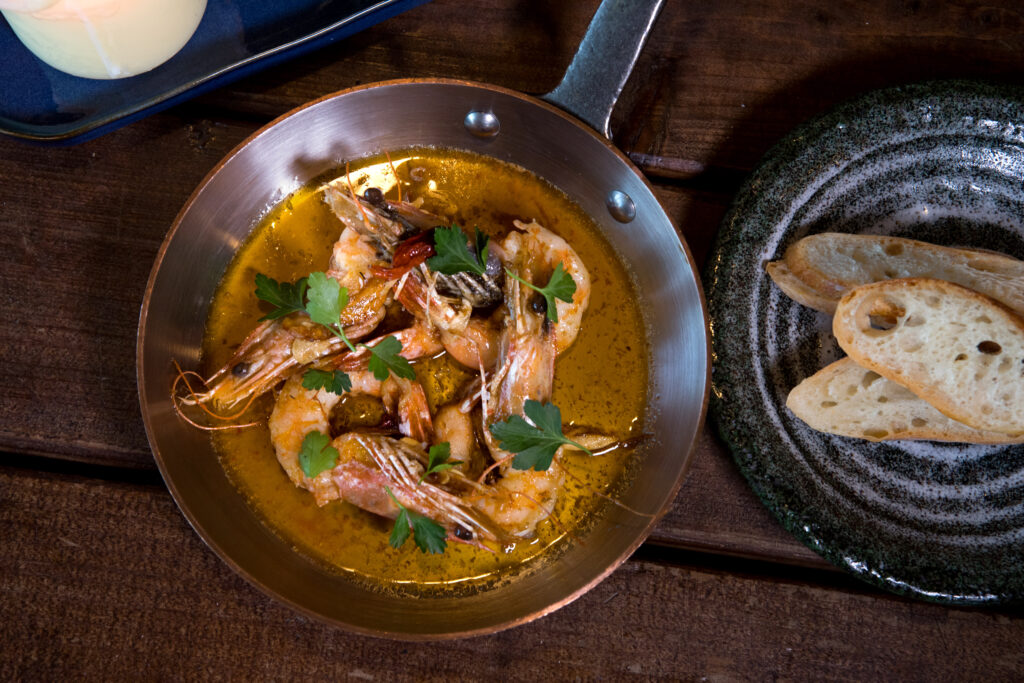Gambas al ajillo, includes prawns, roasted garlic and olive oil, at Animo, a restaurant in Sonoma, Calif., on Wednesday, March 30, 2022. (Photo by Darryl Bush / For The Press Democrat)