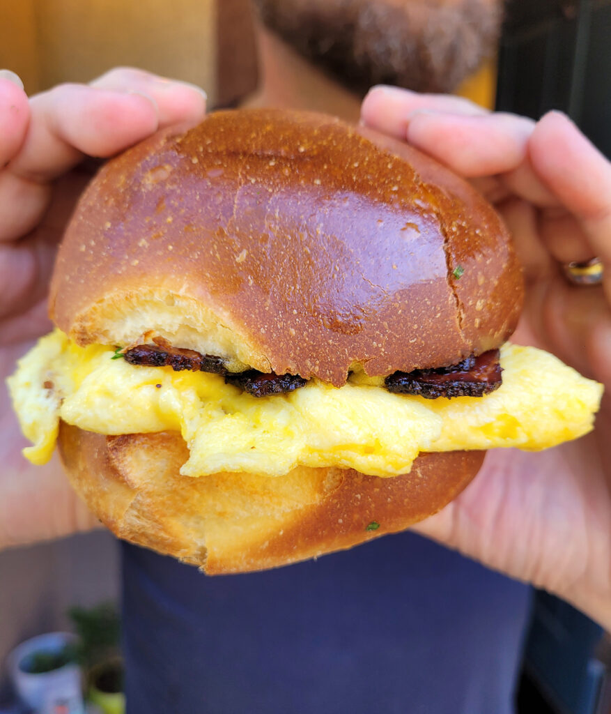 The Standard: Housemade Brioche bun with scrambled eggs, Gruyere, onion jam, tangy bernaise and bacon at Sonoma Mountain Breads. (Heather Irwin/Sonoma Magazine)