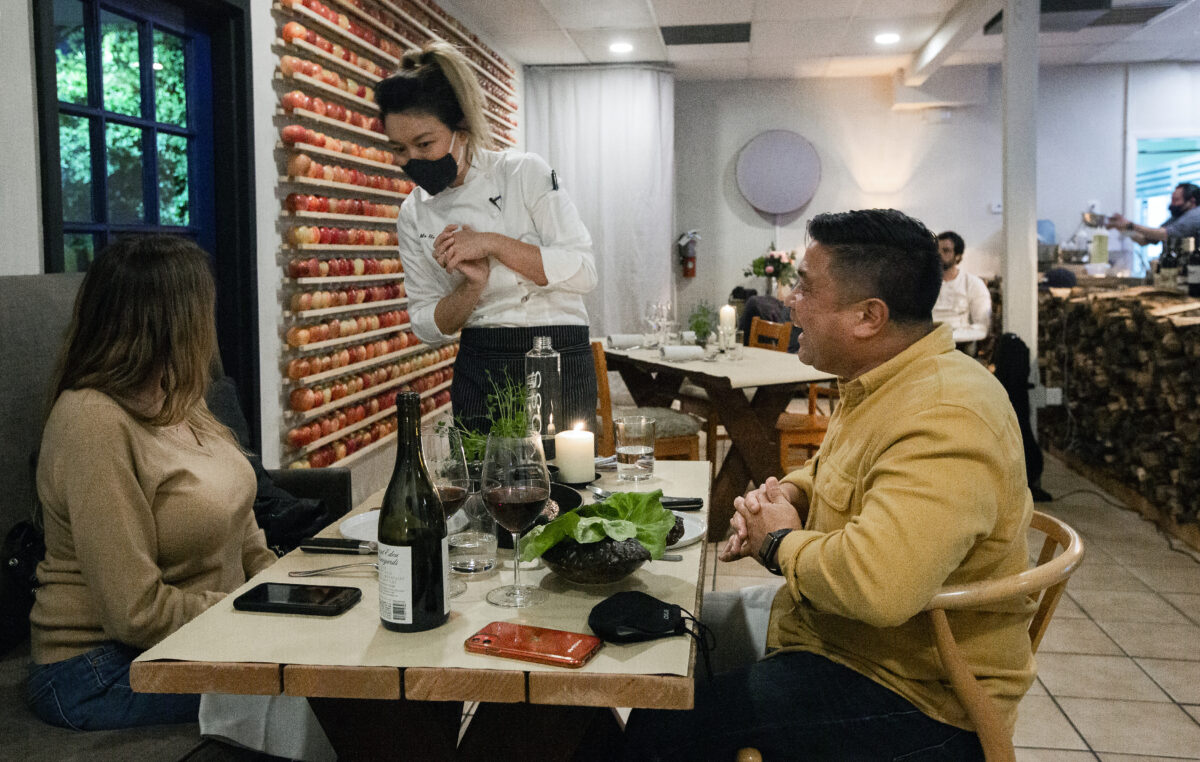 Heidy Mu He chats with opening day customers Kirsten Simone Rhude and Mel Salada at the Animo restaurant on Highway 12, near the intersection of Verano Avenue on Wednesday, Feb. 2, 2022. (Robbi Pengelly/Sonoma Index-Tribune)