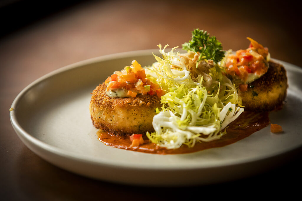 Low Country Crab Cakes with pepper coulis, old bay and chop chop & remoulade from Easy Rider in Petaluma on Tuesday, March 1, 2022. (John Burgess/The Press Democrat)