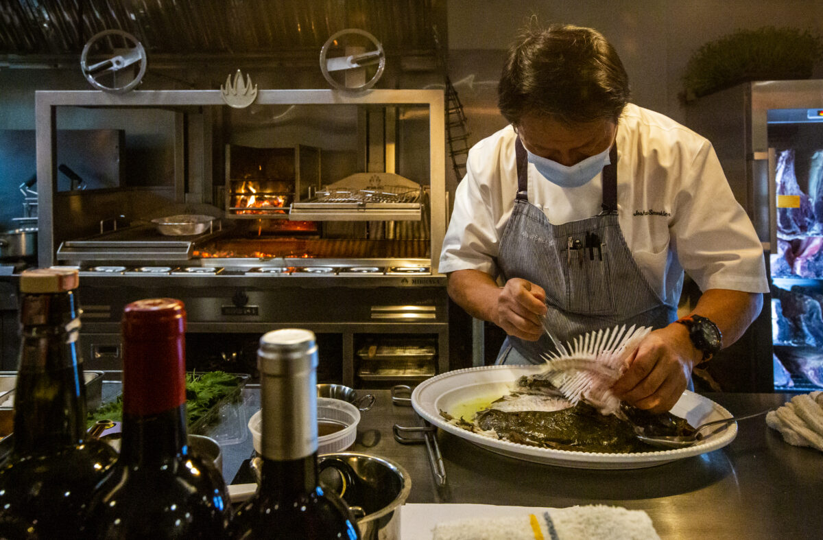 Proprietor and chef Josh Smookler debones a turbot on the opening day of the restaurant Animo on Highway 12, near the intersection of Verano Avenue on Wednesday, Feb. 2, 2022. (Robbi Pengelly/Index-Tribune)