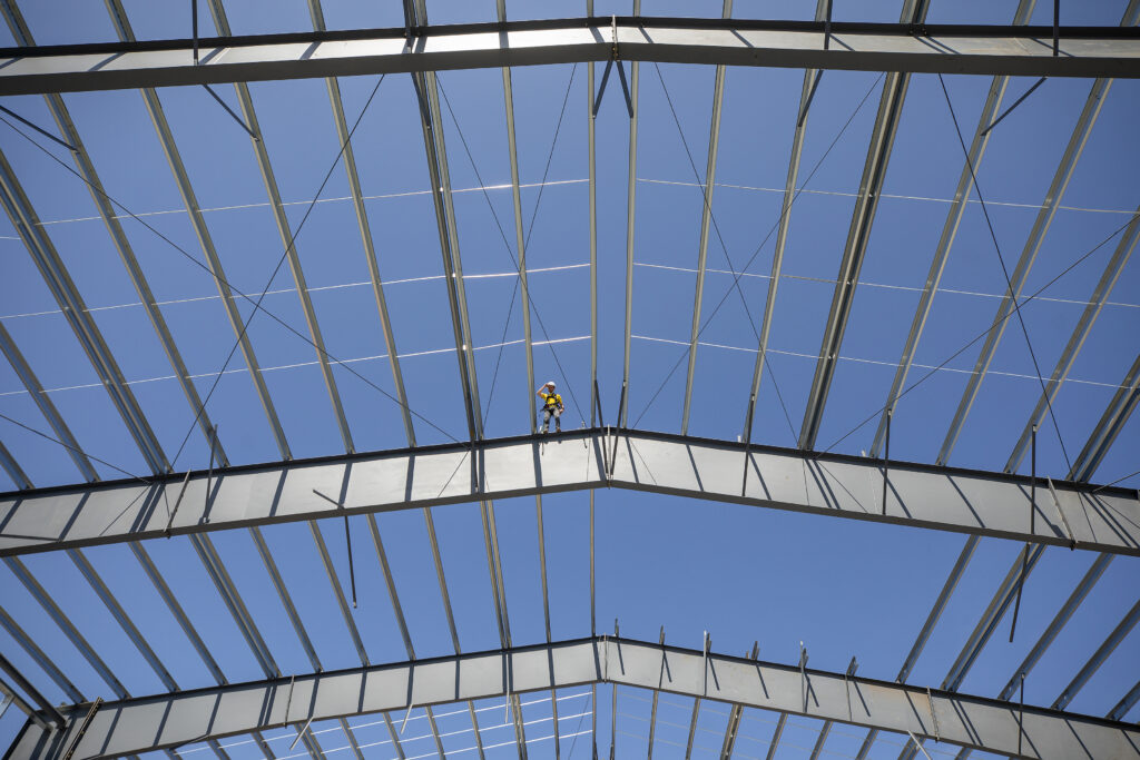 Local rock climber Kevin Jorgeson, who completed a free climb of the Dawn Wall of El Capitan in Yosemite National Park, stands 50 feet above the ground on the steel girders of the new 23,000-square foot rock climbing gym on A Street in Santa Rosa on Tuesday, April 6, 2021. (Photo by John Burgess/The Press Democrat)