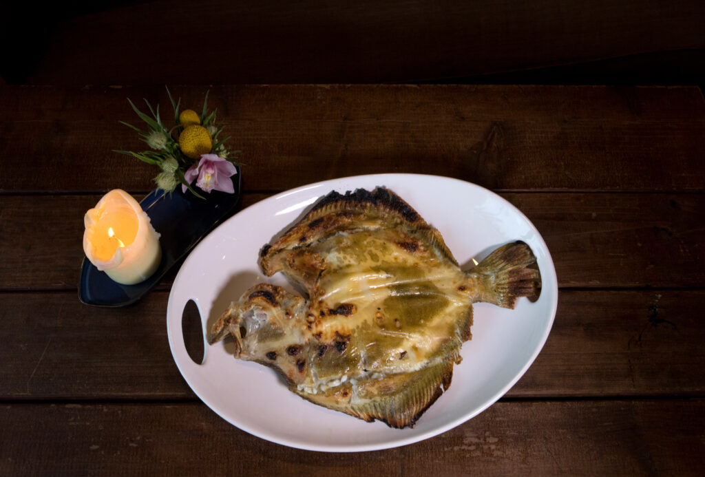 Turbot, is served on a large plate at Animo, a restaurant in Sonoma, Calif., on Wednesday, March 30, 2022. (Photo by Darryl Bush / For The Press Democrat)