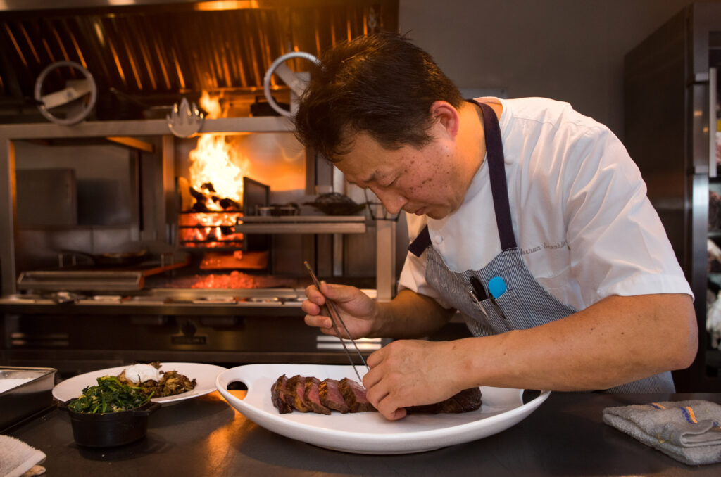 Co-owner Joshua Smookler prepares Wagyu Ribeye at his restaurant, Animo, in Sonoma, Calif., on Wednesday, March 30, 2022. (Photo by Darryl Bush / For The Press Democrat)