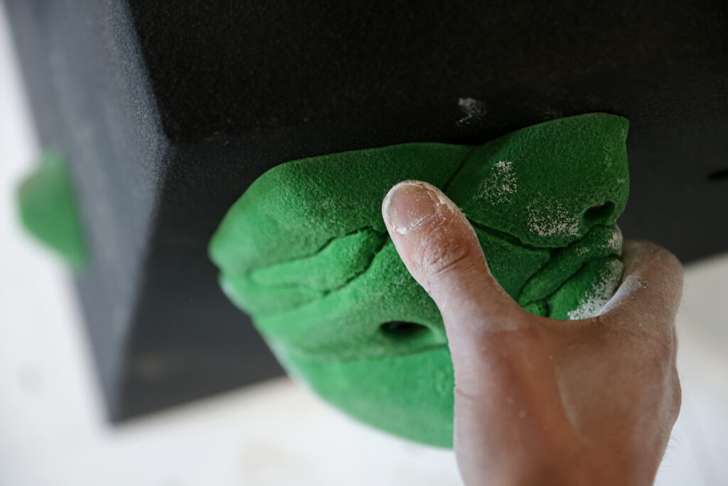 Kevin Jorgeson grabs onto a hold at Session Climbing in Santa Rosa on Thursday, January 27, 2022. (Christopher Chung/ The Press Democrat)