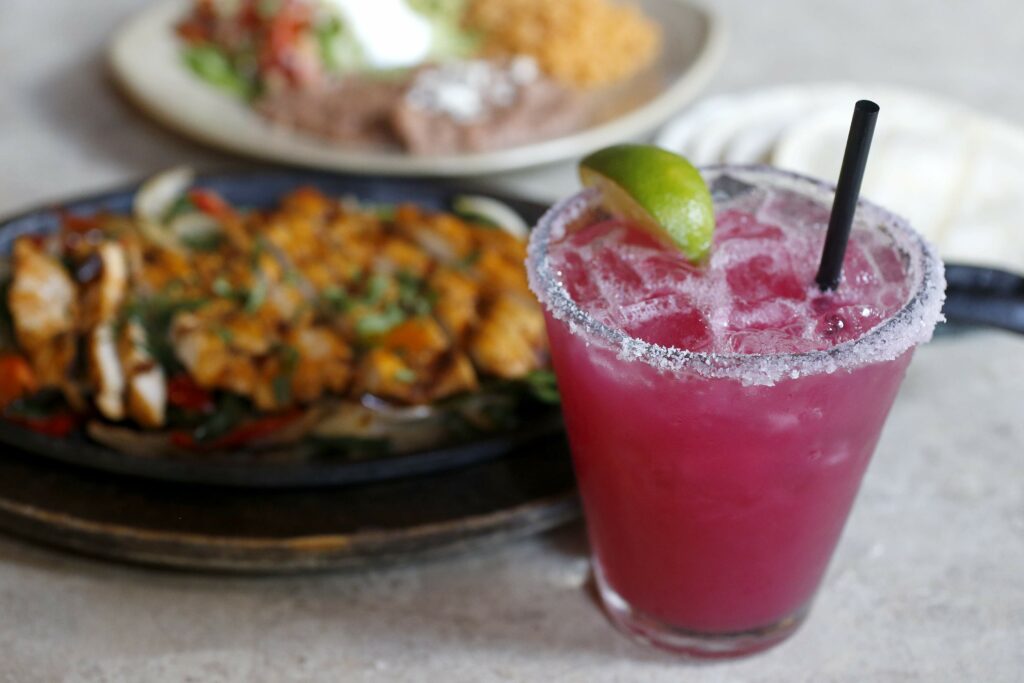 La Rosa Tequileria & Grille in Santa Rosa. Shown here is a Prickly Pear Margarita with chicken fajitas. (BETH SCHLANKER/ The Press Democrat) See more at BiteClubEats.com.