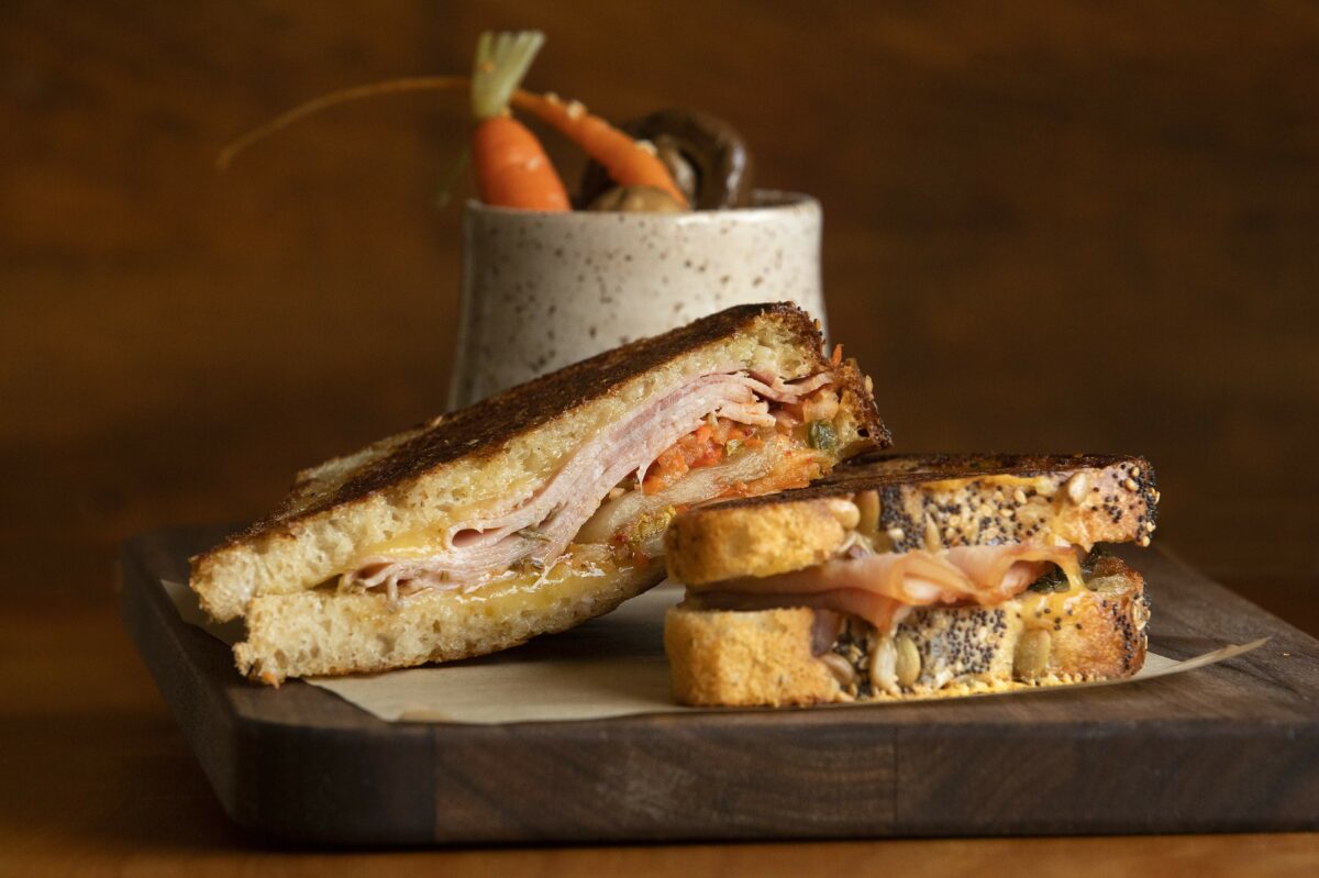 Grilled Cheese with Hwy 1 Fontina, rosemary ham and kimchi with a side of garden pickles from the Valley Ford Cheese and Creamery in Valley Ford. (John Burgess/Sonoma Magazine)