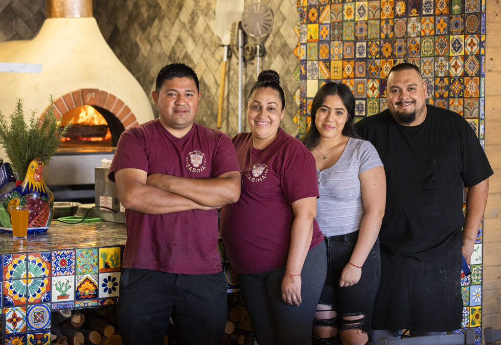 Its a family affair at Pezcow in Windsor with, from left, owner Damien Zuniga, sister Maria Reynaga, niece Andrea Ruiz and brother Luis all helping out in the kitchen on Friday, April 1, 2022. (John Burgess/The Press Democrat)