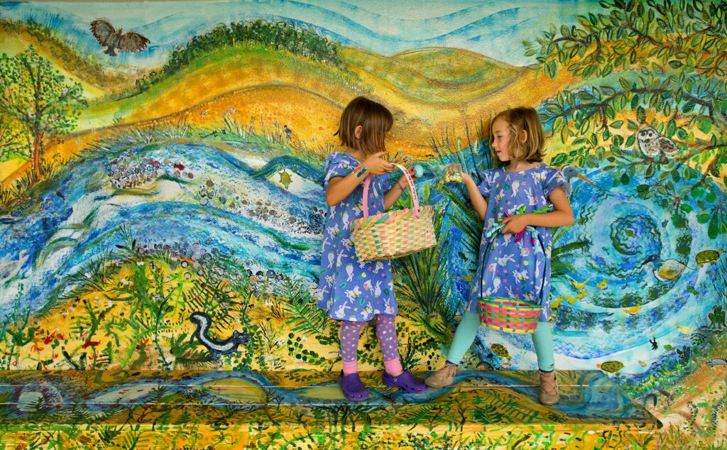 Friends Amelia Taylor, 6, left, and Aria Leibert, 6, compare their baskets of goodies at the 30th annual Glen Ellen Easter egg hunt at Dunbar School. (John Burgess/The Press Democrat)
