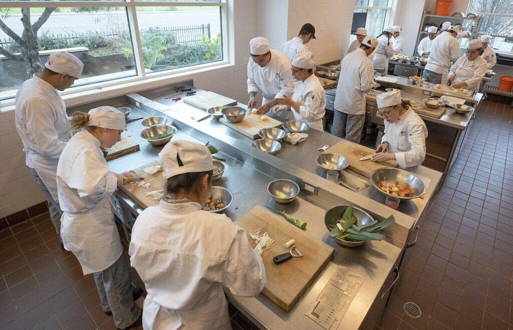 The knife skills class at the SRJC Culinary Arts Center. Due to lower enrollment, the center will delay opening the Cafe Rose for regular lunches this semester. (photo by John Burgess/The Press Democrat)