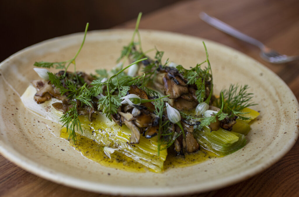 Chef Bryan Oliver's leeks and mushrooms at Little Saint in downtown Healdsburg on April 22, 2022. (Chad Surmick/The Press Democrat)