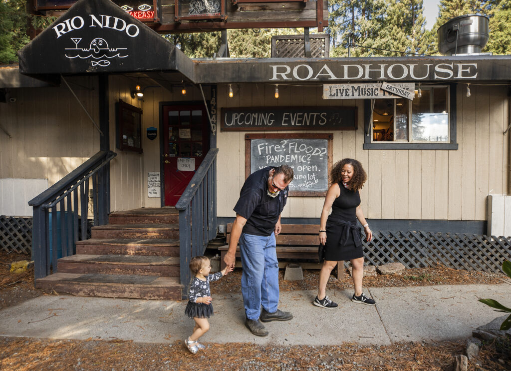 Rio Nido Roadhouse owners Brad and Reana Metzger, with their daughter Penelope, 17 months are breathing easier after winning a appeals court decision in an 8 year battle over disabled access to the restaurant, bar and pool along the Russian River. (Photo by John Burgess/The Press Democrat)