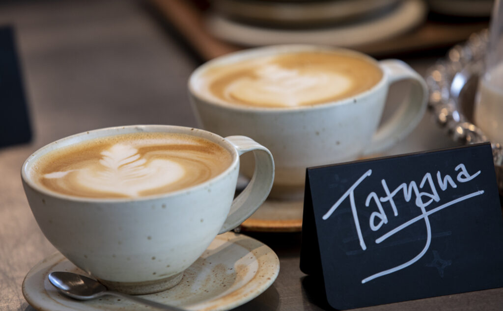 Two cappuccinos for customer Tatyana wait to be picked up at Little Saint during Friday's grand opening in downtown Healdsburg on April 22, 2022. (Chad Surmick / The Press Democrat)