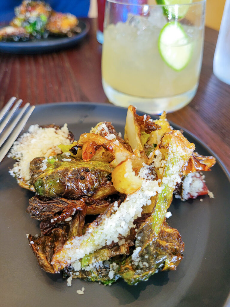Brussels with cotija and bacon with a mezcal margarita at Kina’s Kitchen and Bar in Sonoma. (Heather Irwin/Sonoma Magazine)