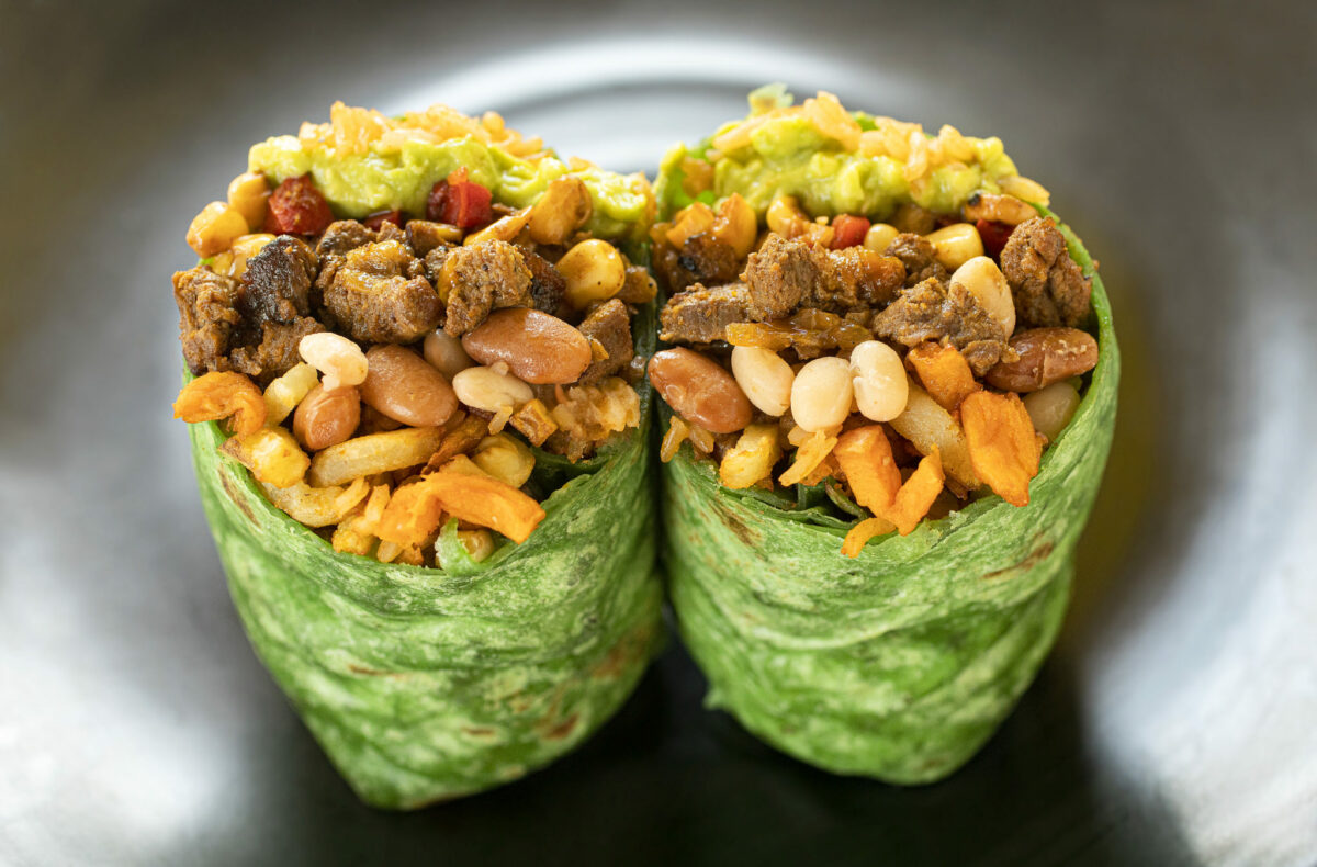 Tropical Beef Burrito with tropical potato mix, pinto and white beans, Spanish rice, guacamole, roasted corn & red pepper salsa in a spinach tortilla from Don Julio's Latin Grill & Pupusas in Rohnert Park. (Photo by John Burgess/The Press Democrat)
