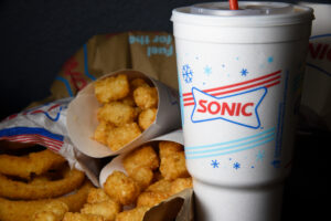 Tater tots, onion rings, and drinks from Sonic fast food chain. (Wild As Light / Shutterstock.com)