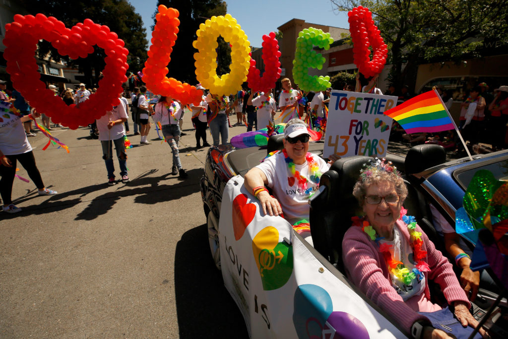 Gladys Purvis, right, and Sharon Long ride with the group from Fountaingrove Lodge during the Sonoma County Pride Parade in Santa Rosa, California, on Saturday, June 1, 2019. (Alvin Jornada / The Press Democrat)