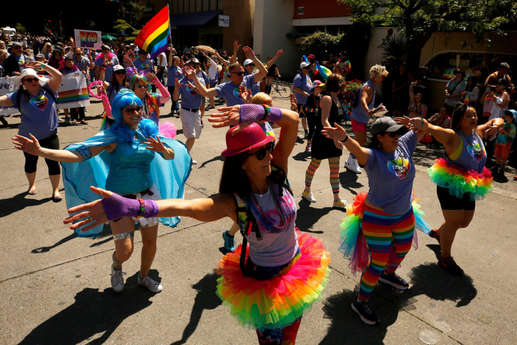 Kaiser Permanente employees dance down 4th Street during the Sonoma County Pride Parade in Santa Rosa, California, on Saturday, June 1, 2019. (Alvin Jornada / The Press Democrat)