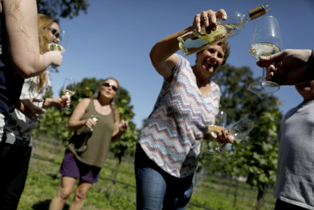 Owner Pam Willis pours a glass of Loxton Sencillo 2019 made with riesling grapes grown by Larry and Pam Willis at The Gables Wine Country Inn in Santa Rosa, Calif., on Sunday, May 1, 2022. (Beth Schlanker/The Press Democrat)