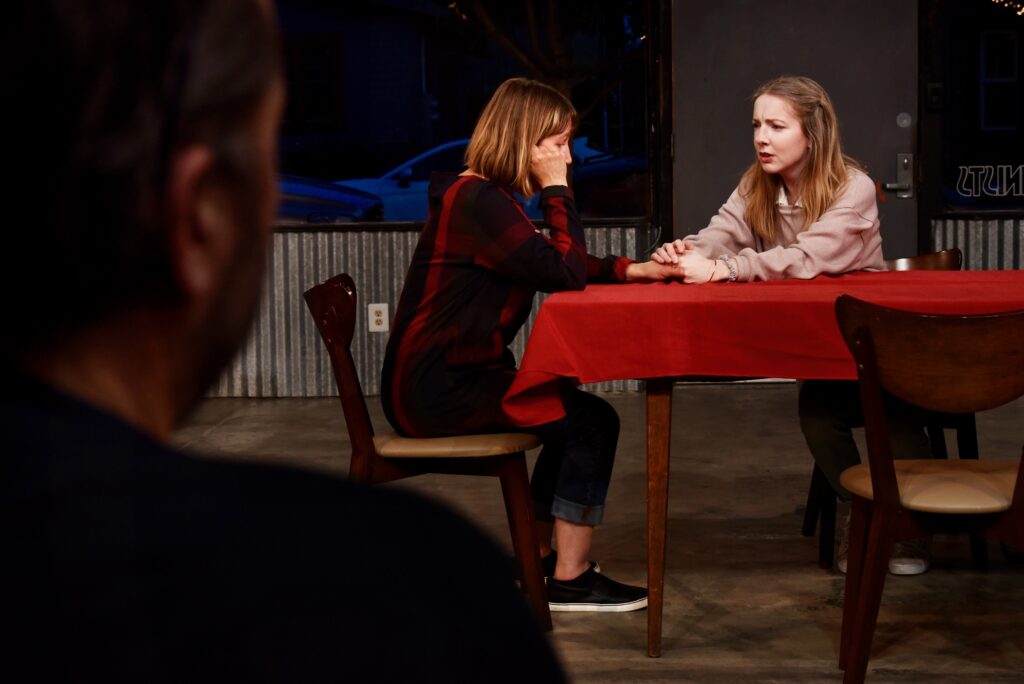 Hungarian director ¡rp·d Schilling, left, watching a scene between Imaginists theater co-founder and actress Amy Pinto, center, and Emma Attwood during a dress rehearsal for ìS D A (Someone Dies Again),î a new work that focuses on the role that gun violence play in American society at The Imaginists theater in Santa Rosa, Calif., on Monday, April 30, 2022. (Erik Castro/For The Press Democrat)