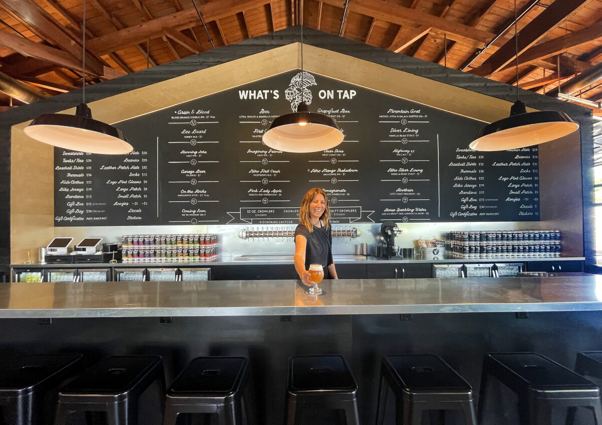 Karly Church serves up a beer at the new Crooked Goat Brewing Co. taproom on Howard St. in Petaluma on May 17, 2022. (John Burgess/The Press Democrat)