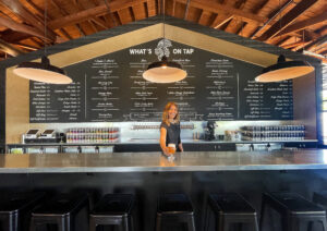 Karly Church serves up a beer at the new Crooked Goat Brewing Co. taproom on Howard St. in Petaluma on May 17, 2022. (John Burgess/The Press Democrat)