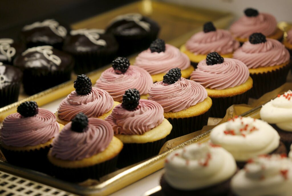 A variety of cupcakes in the case at Della Fattoria in Petaluma. (Beth Schlanker/The Press Democrat)