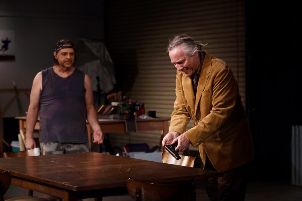 Imaginists theater co-founder and actor Brent Lindsay, right, and David Roby during a dress rehearsal scene for ìS D A (Someone Dies Again),î a new work that focuses on the role that gun violence play in American society at The Imaginists theater in Santa Rosa, Calif., on Monday, April 30, 2022. (Erik Castro/For The Press Democrat)