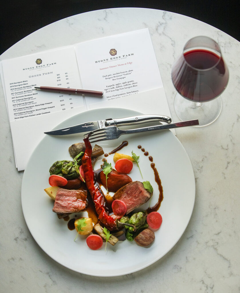 Painted Hills New York steak with Jimmy Nardello, tomatillos, shelling beans and padrón peppers served with Stone Edge Farm Cabernet Sauvignon, the third course of the ever changing Prix-fixe menu from EDGE restaurant in Sonoma. (John Burgess/The Press Democrat)