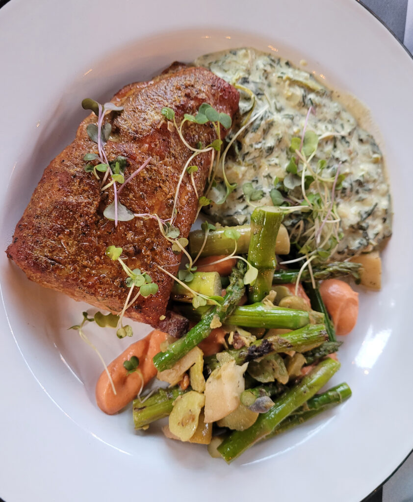 Smoked pork loin with creamed spinach and asparagus hash at Tips Roadside Test Kitchen in Kenwood. (Heather Irwin/Sonoma Magazine)