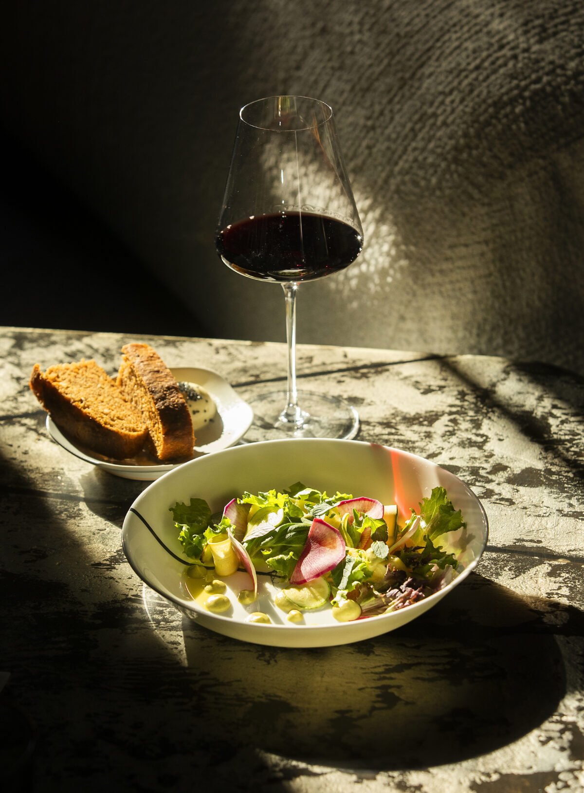 Silver Cloud potatoes with huacatay, baby lettuces, watermelon radish and zucchini served with Stone Edge Farm Surround, Red Bordeaux Blend, the second course of the ever changing Prix-fixe menu from EDGE restaurant in Sonoma. (Photo by John Burgess/The Press Democrat)