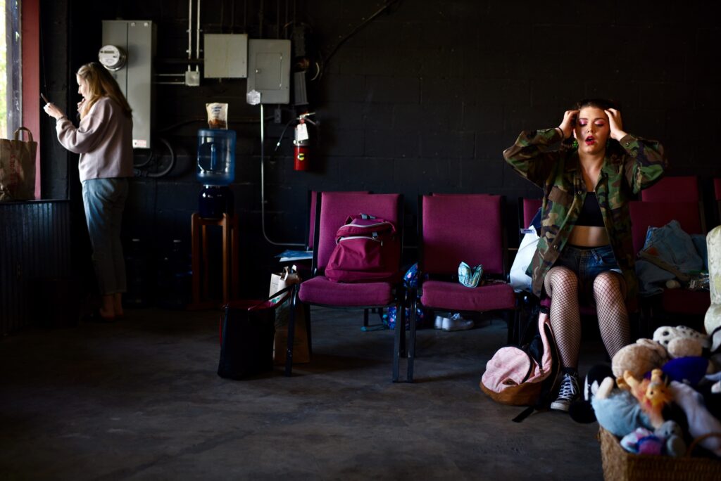 Actresses Emmat Attwood, left, and Karina Pugh preparing their characterís costume and makeup during a dress rehearsal for ìS D A (Someone Dies Again),î a new work that focuses on the role that gun violence play in American society at The Imaginists theater in Santa Rosa, Calif., on Monday, April 30, 2022. (Erik Castro/For The Press Democrat)