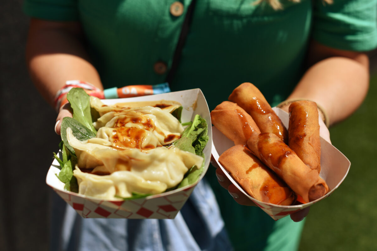 Bling Bling Dumpling booth serves up fried pork dumplings with veggie spring rolls Friday, May 27, 2022, during BottleRock Napa Valley in Napa. (Erik Castro / For The Press Democrat)