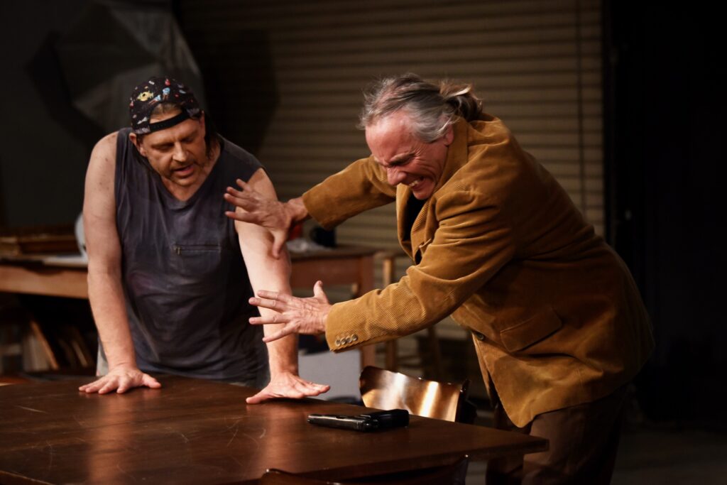 Imaginists theater co-founder and actor Brent Lindsay, right, and David Roby during a dress rehearsal scene for “S D A (Someone Dies Again),” a new work that focuses on the role that gun violence play in American society at The Imaginists theater in Santa Rosa, Calif., on Monday, April 30, 2022. (Erik Castro/For The Press Democrat)