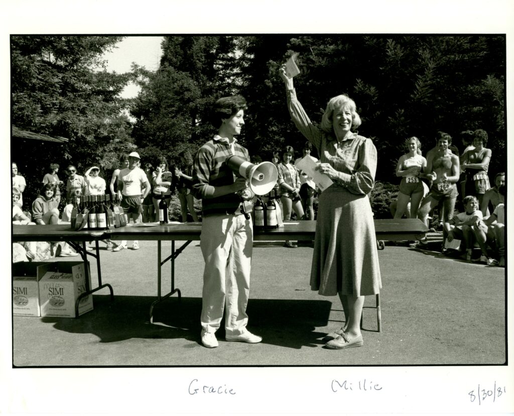 Millie Howie at the “Come Up to Simi” 10K run on Aug. 30, 1981, with Simi’s vice president of public affairs Gracelyn Blackmer (left). The event raised money for the Wine Library and Millie is holding up the check. (Photo by Lenny Siegel)