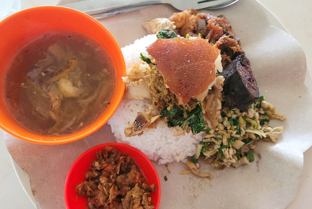 Roast pork (babi guling) at a roadside stand near Ubud, Bali. (Heather Irwin/The Press Democrat)