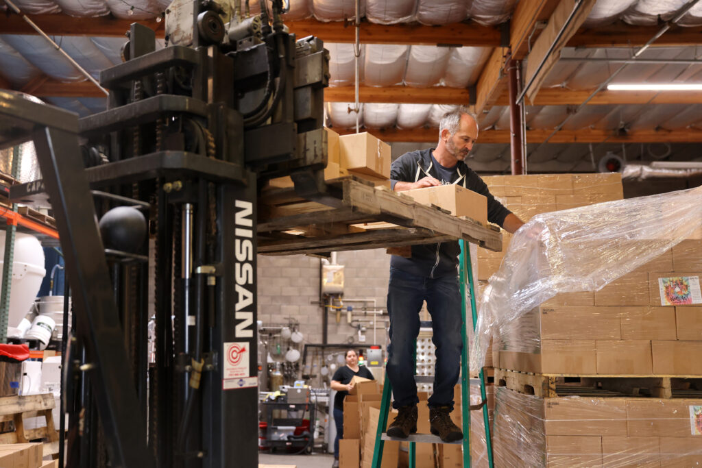 Winemaker William Allen loads boxes of canned wine for a distributor at Two Shepherds in Windsor, Calif. on Tuesday, May 31, 2022. (Beth Schlanker/The Press Democrat)