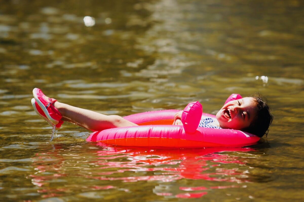 Tamara Bautista, 3, laughs as she floats in the water at Veterans Memorial Beach in Healdsburg, California on Saturday, June 18, 2016. (Alvin Jornada / The Press Democrat)