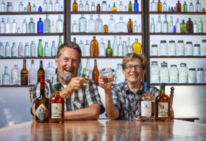 Gail Coppinger, right, and Scott Woodson, owners of Elk Fence Distillery, make Fir Top Gin, The Briny Deep Whiskey and White Elk Vodka in the only distillery in Santa Rosa. (John Burgess / The Press Democrat)