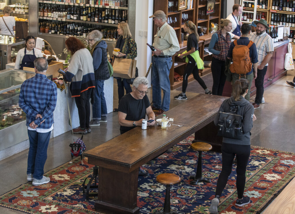 Lunch goers line up to pick up orders at Little Saint during the grand opening in downtown Healdsburg on April 22, 2022. (Chad Surmick / The Press Democrat)