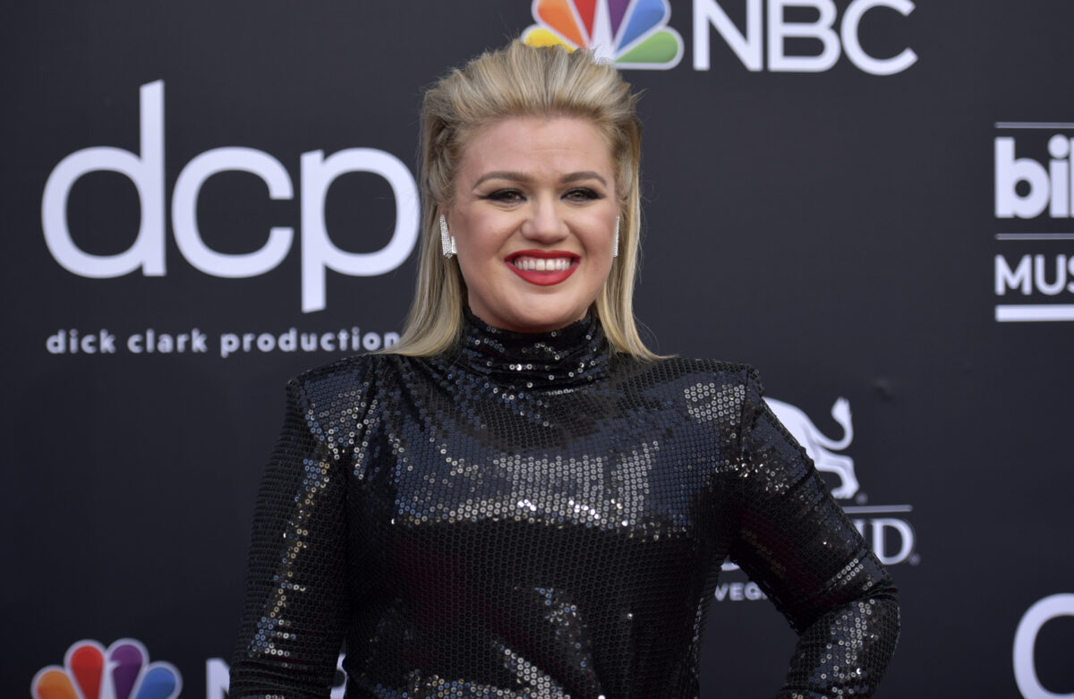 FILE - Kelly Clarkson arrives at the Billboard Music Awards in Las Vegas on May 1, 2019. Clarkson will host the 2020 Billboard Music Awards on Wednesday. (Photo by Richard Shotwell/Invision/AP, File)