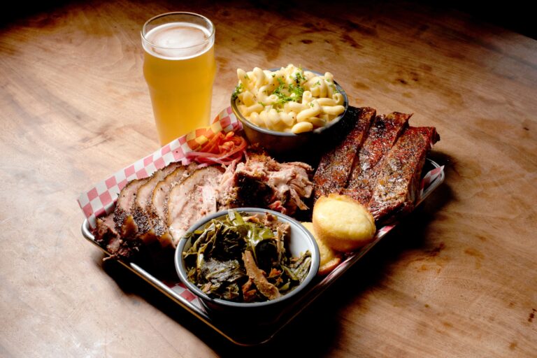 Brisket, pulled pork and ribs with all the sides: collard greens with smoked turkey, mac and cheese, pickled onions, and cornbread, from Austin's Southern Smoke BBQ at Old Possum Brewing Co. in Santa Rosa. (Erik Castro/for Sonoma Magazine)